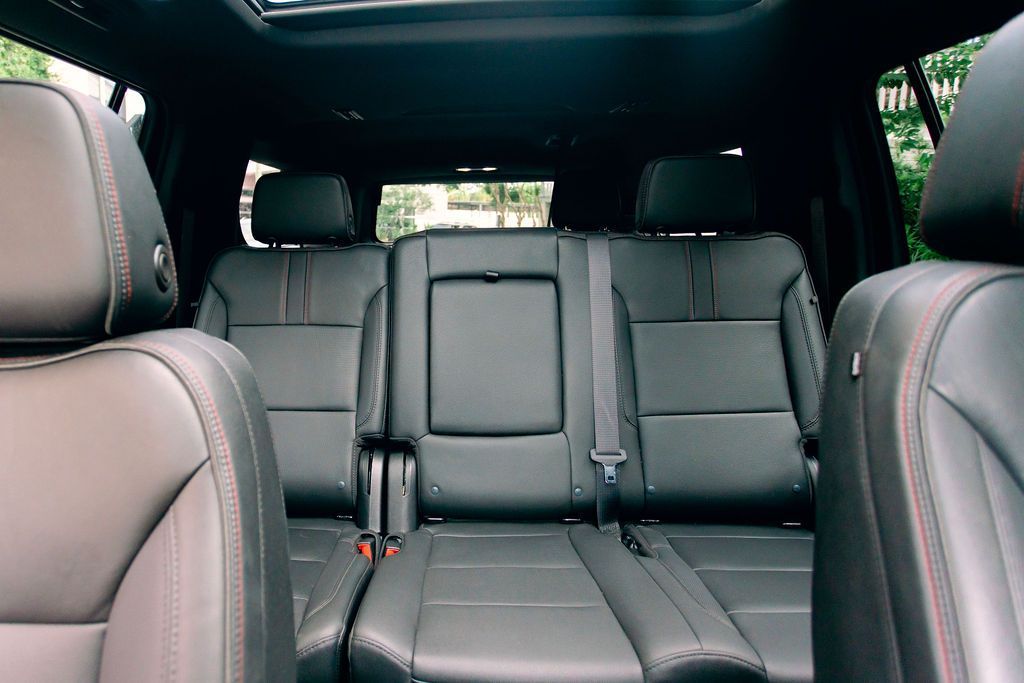 The interior of a car with a steering wheel and dashboard.