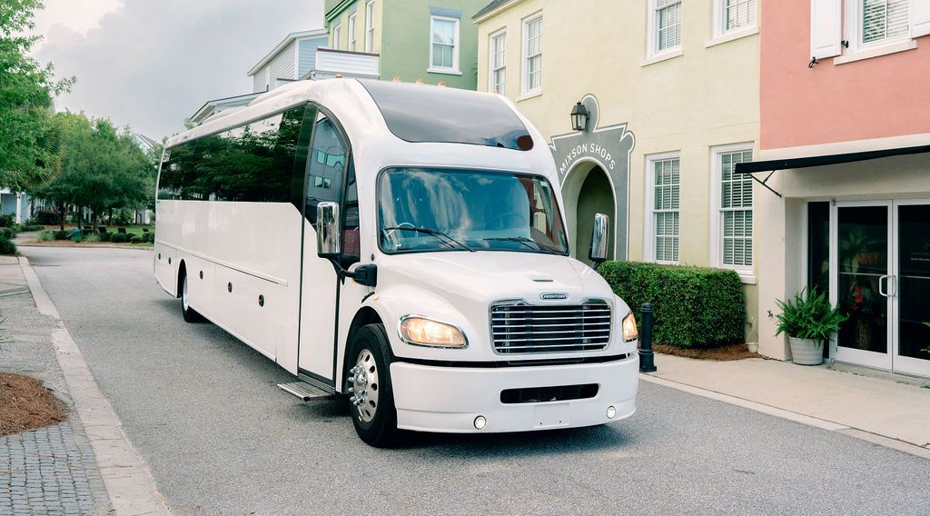 The inside of a bus with a lot of seats and a lot of windows.