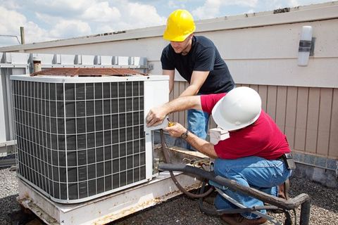 Professional workers installing HVAC units — Orange, VA — W.A. Sherman Company