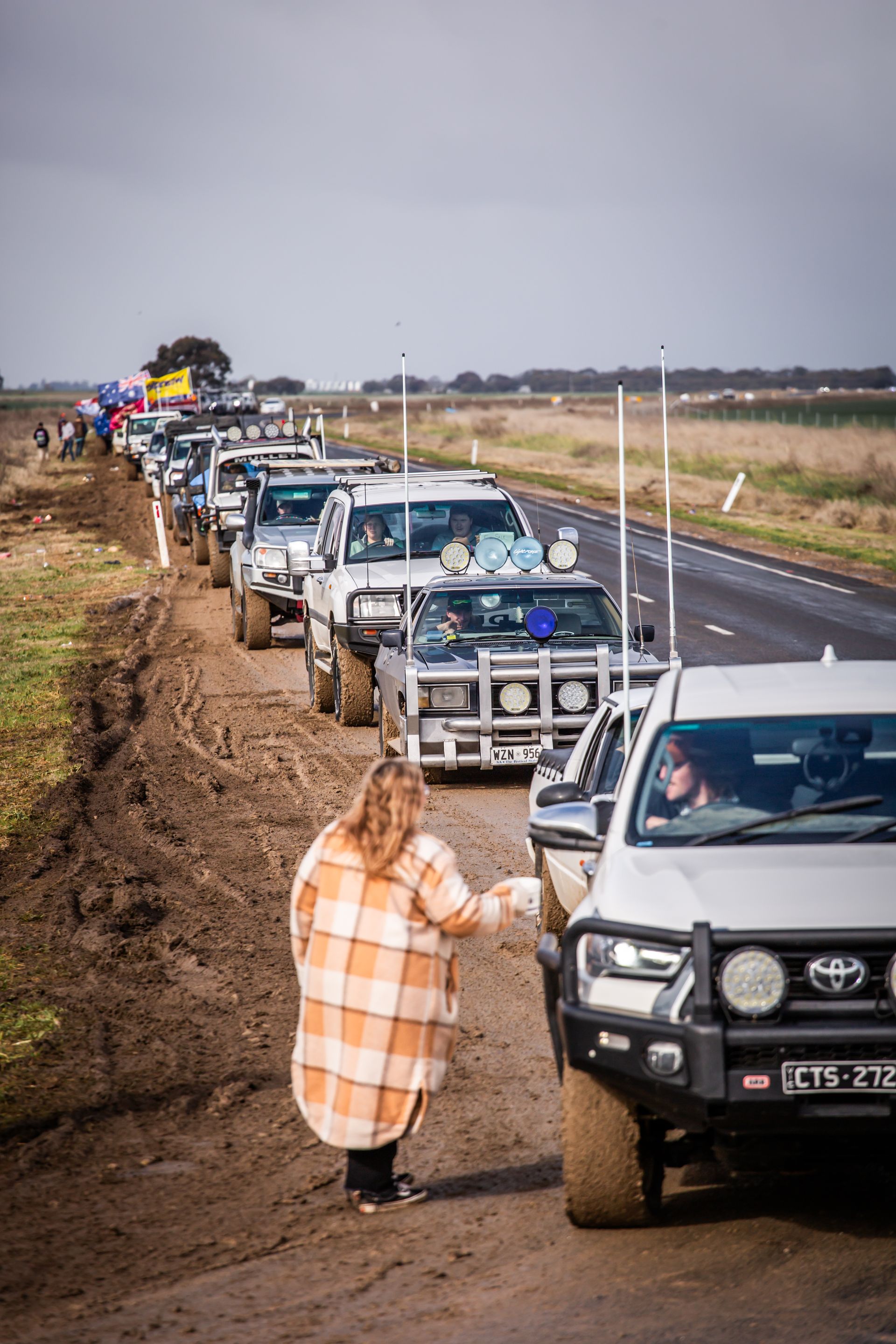 A toyota truck is driving down a dirt road