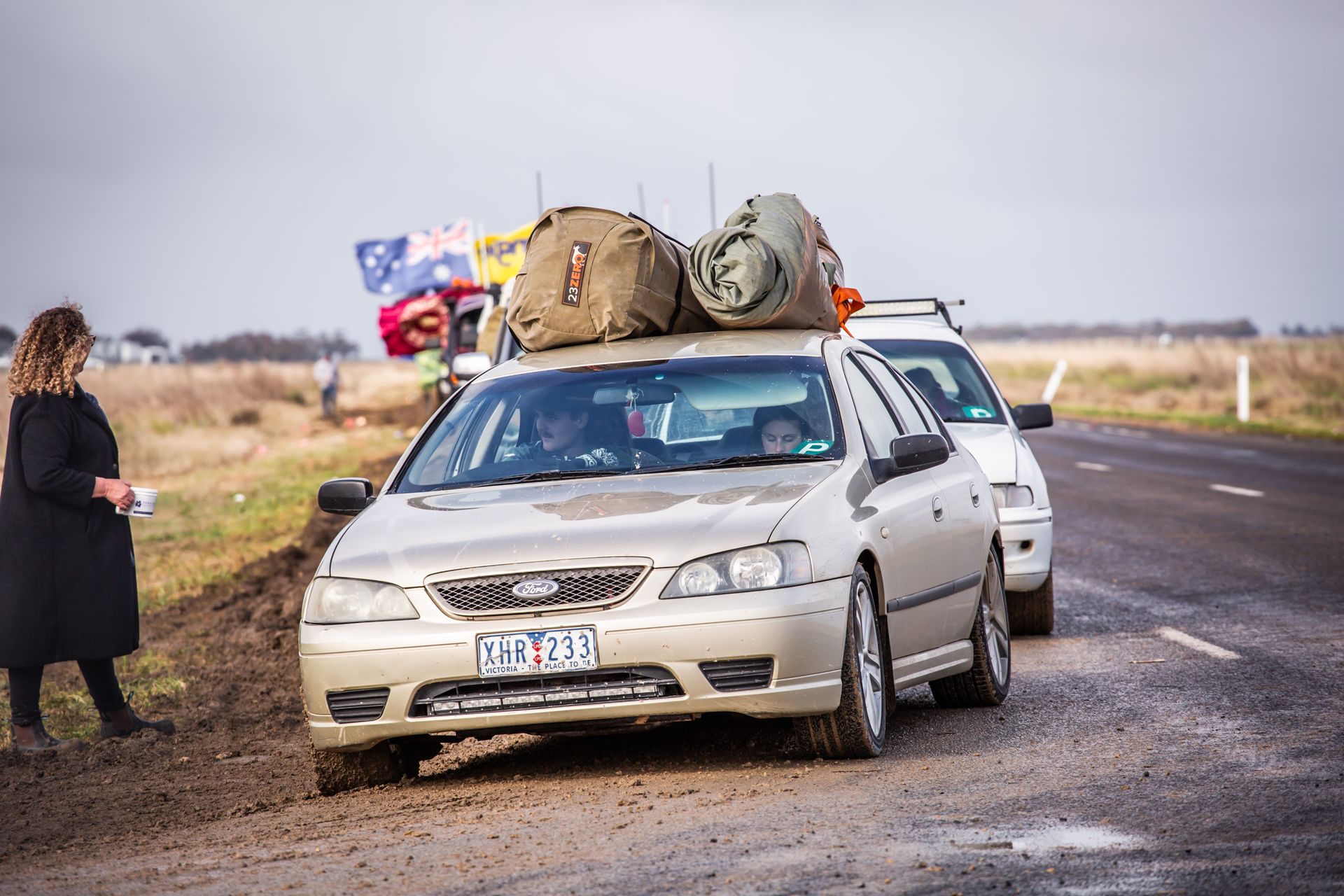 A silver car with a license plate that says dcx 976l