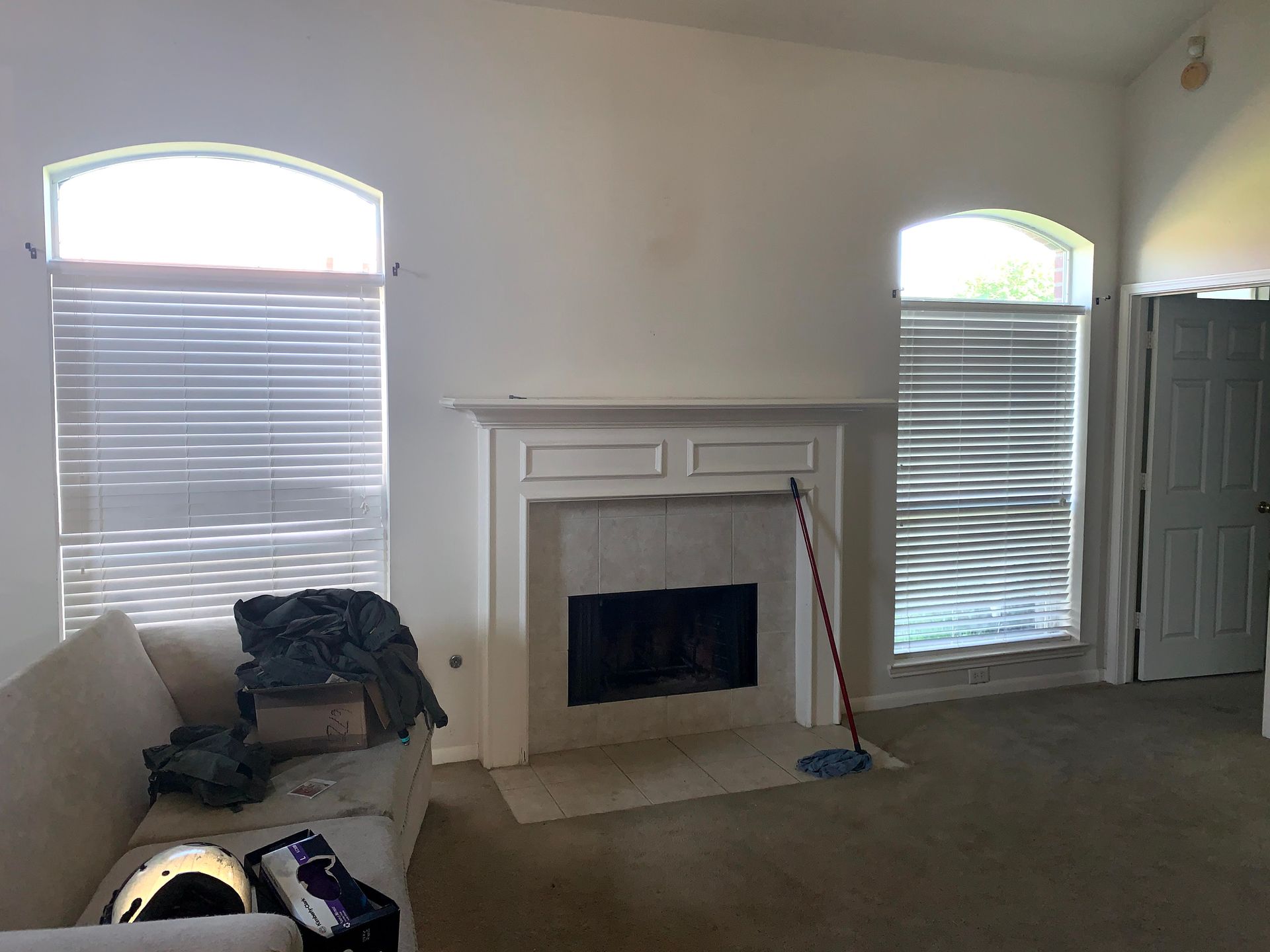 A living room with a fireplace and a couch