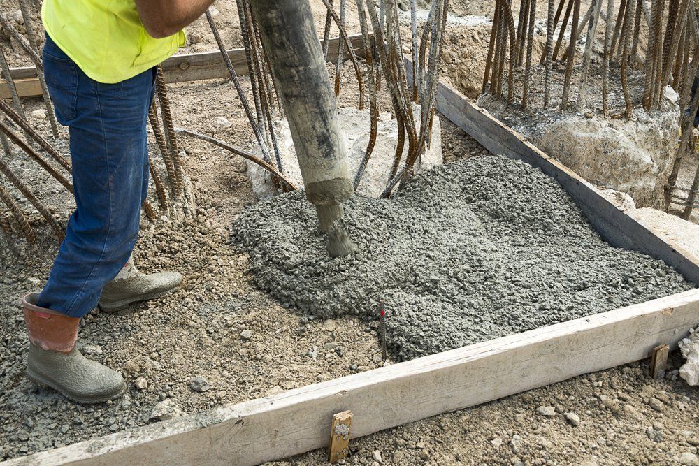 man filling the land with cement