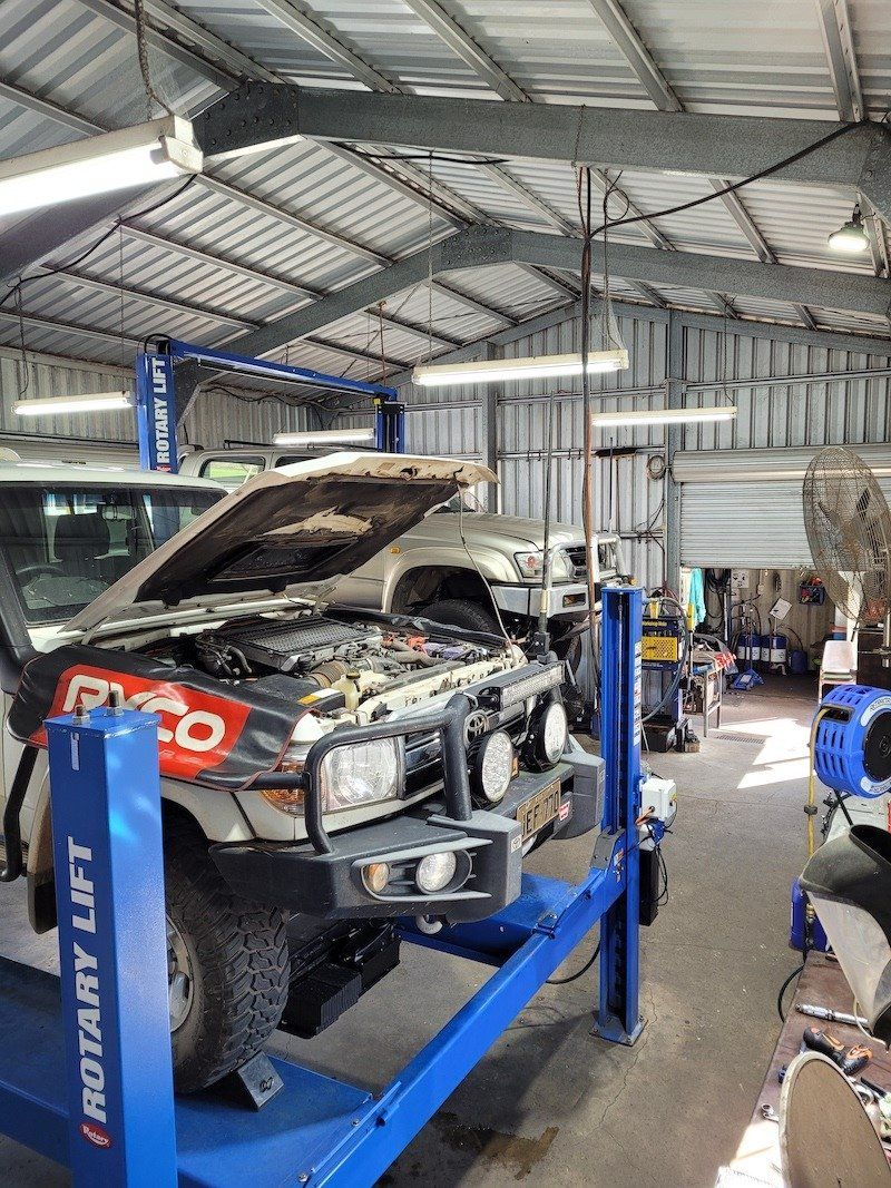 Mechanic Adjusting Car Break — Mechanic in Atherton, QLD