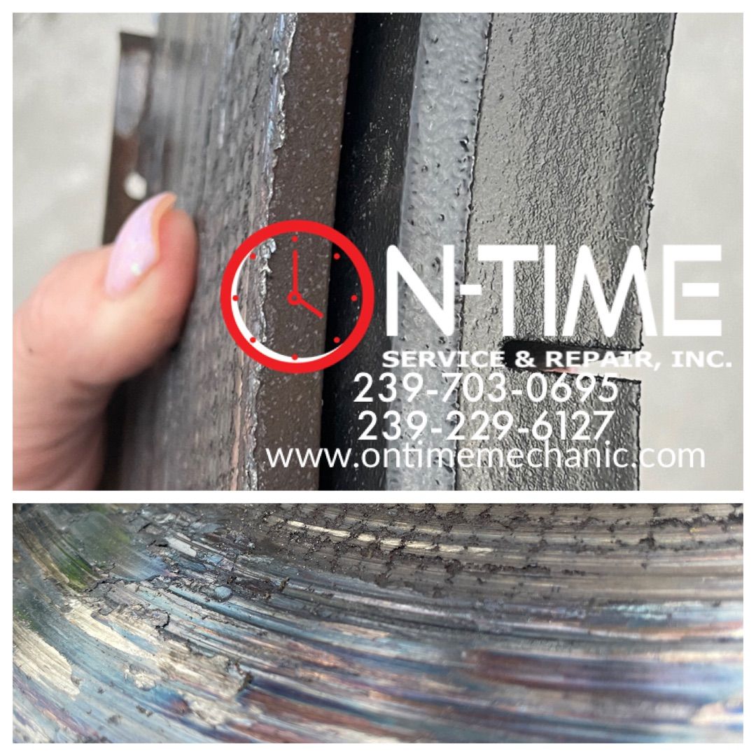 A person is holding a piece of metal that says n-time on it