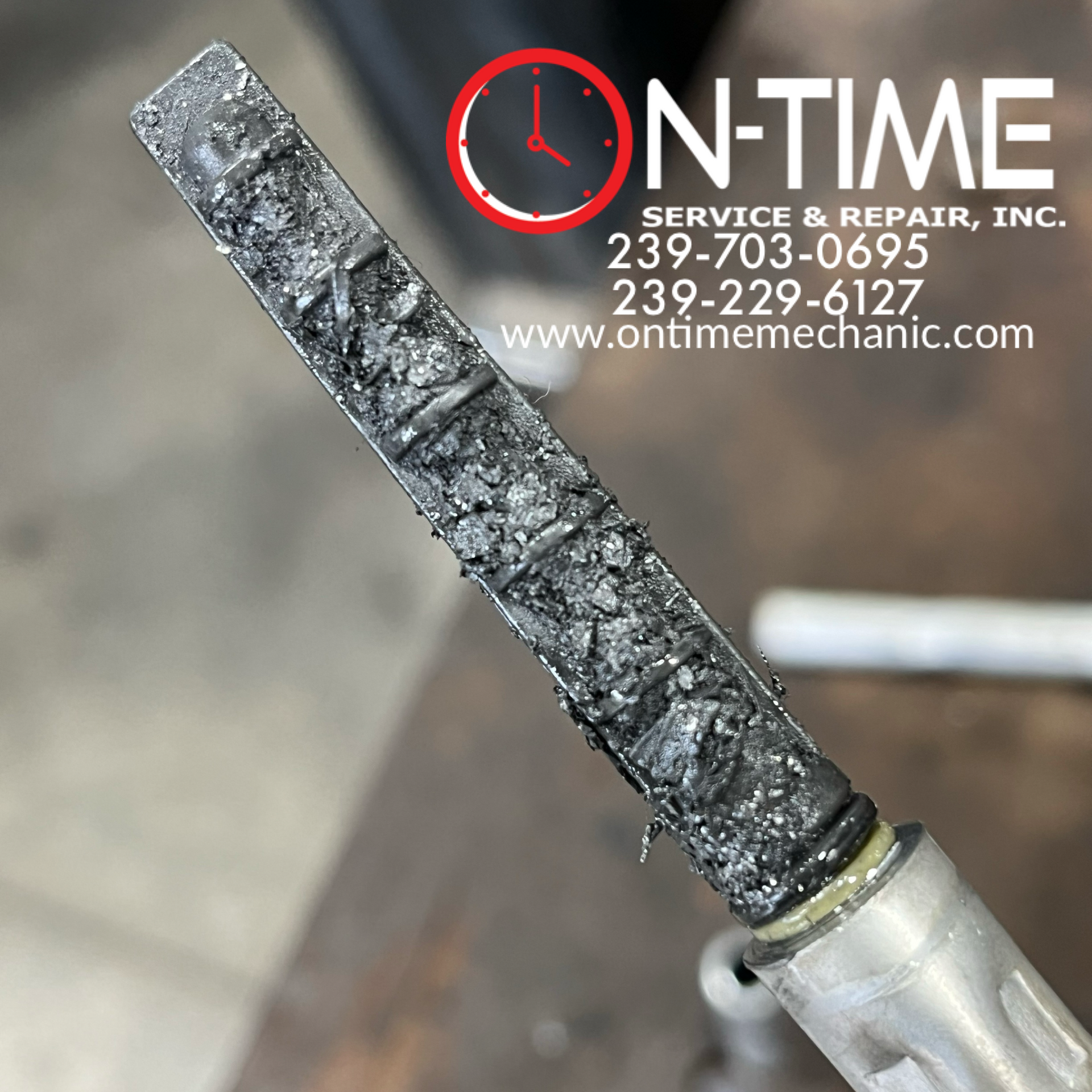 A close up of a piece of metal that says on time service & repair inc.