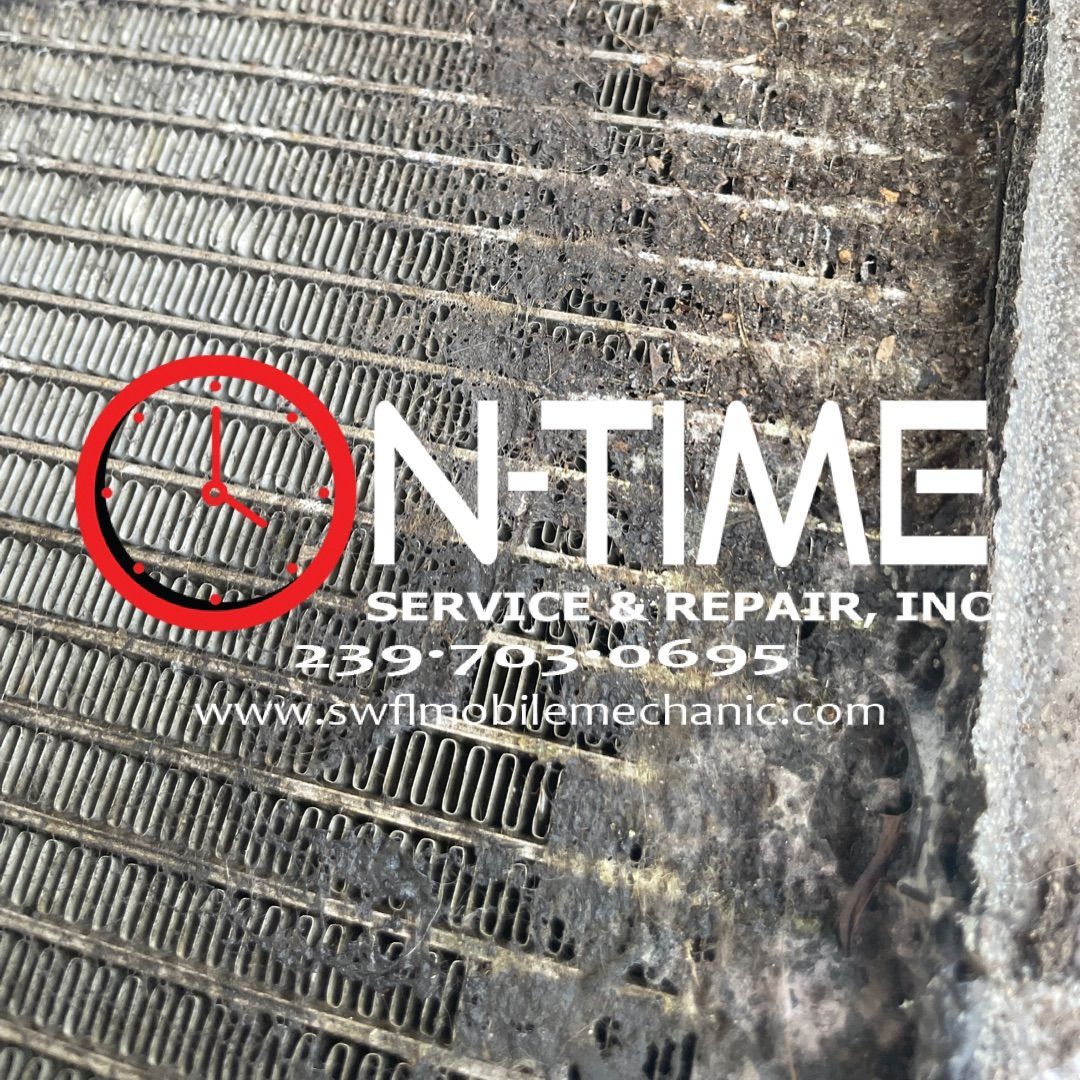 A close up of a radiator with on time service and repair inc. written on it