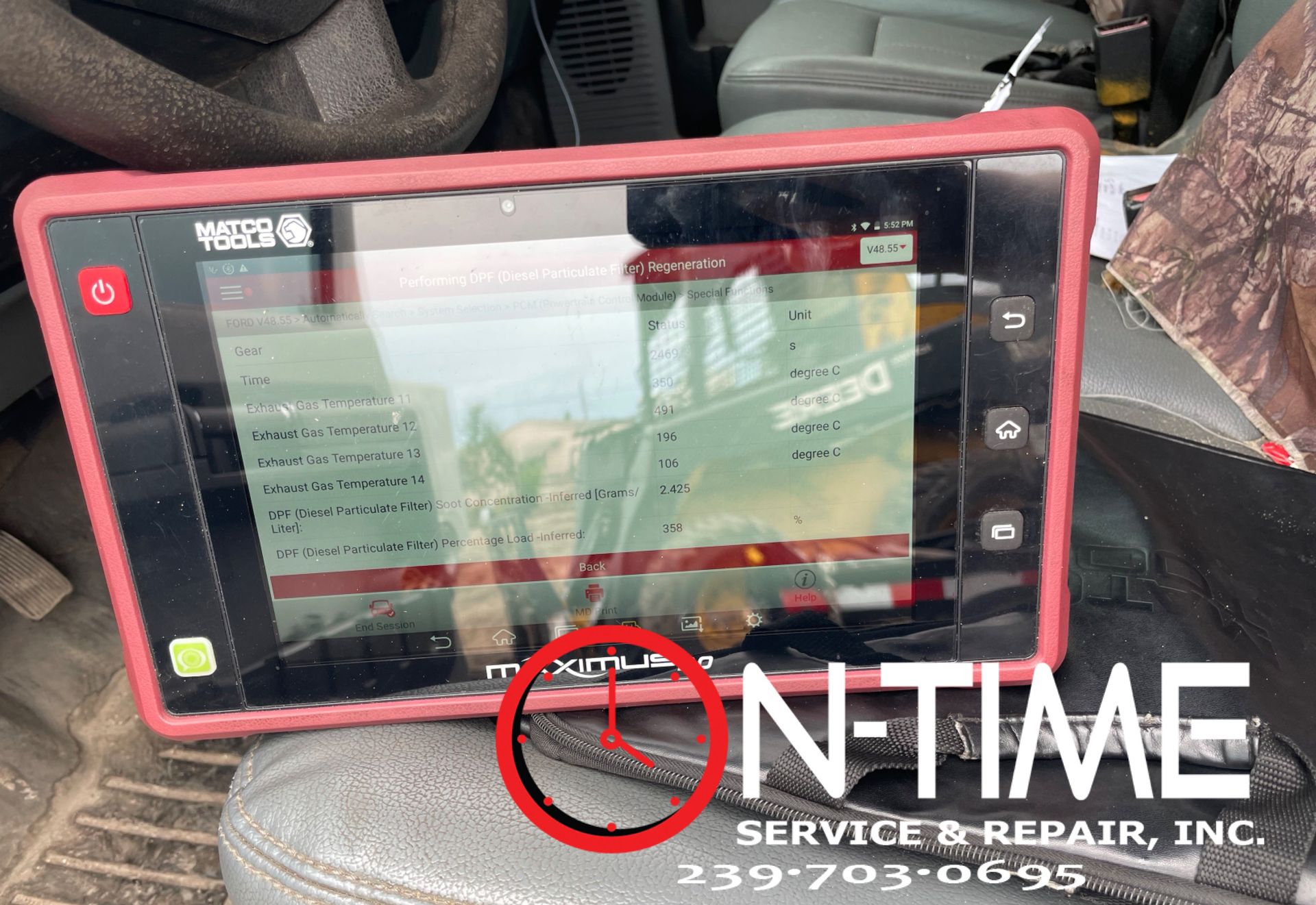 A tablet is sitting in the back seat of a car.