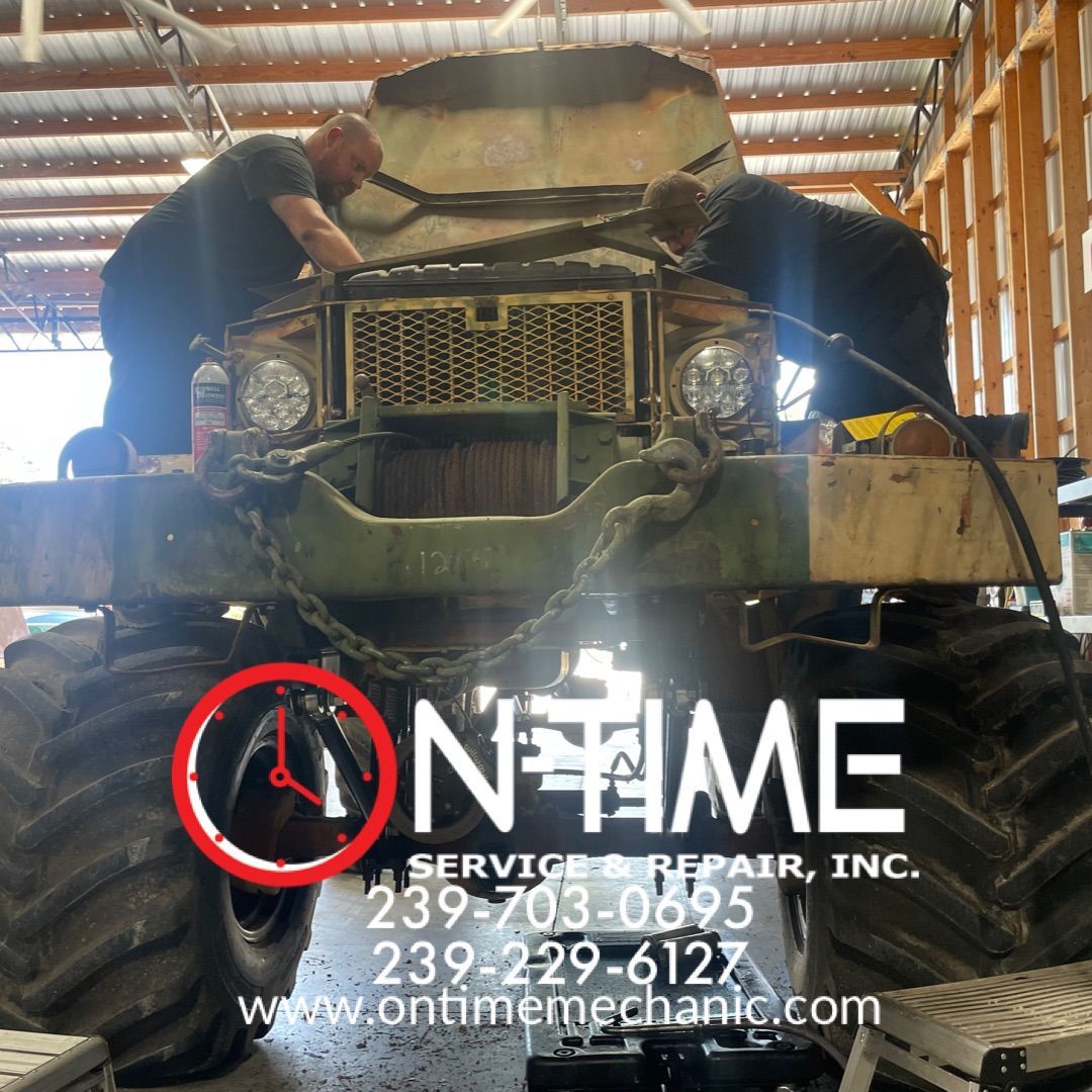 A truck is being worked on by a company called ontime