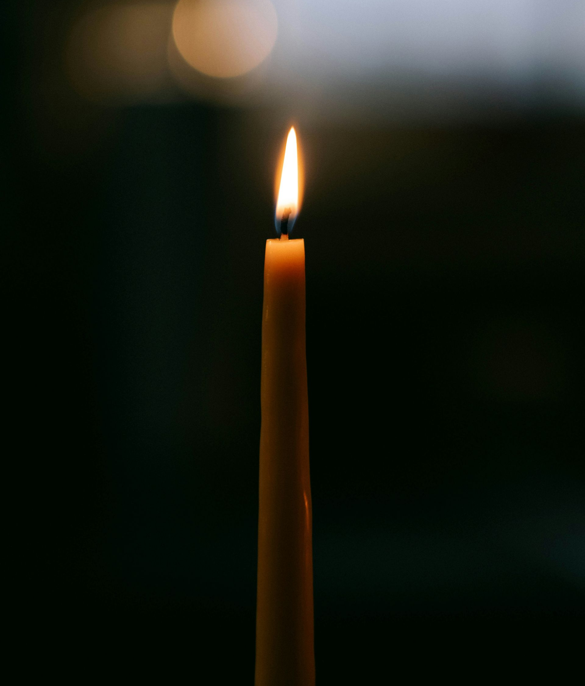 Lit candle representing the inner light of innate worth that's always present