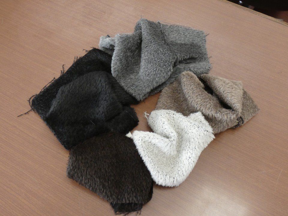 pieces of fabric in shades of grey