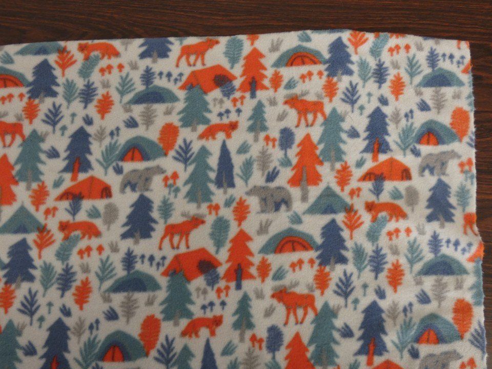 winter fabric with print of trees and animals