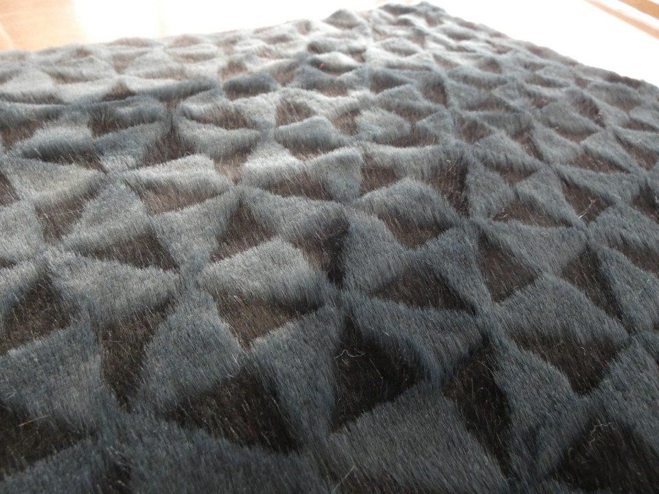 grey fabric with black triangles pattern