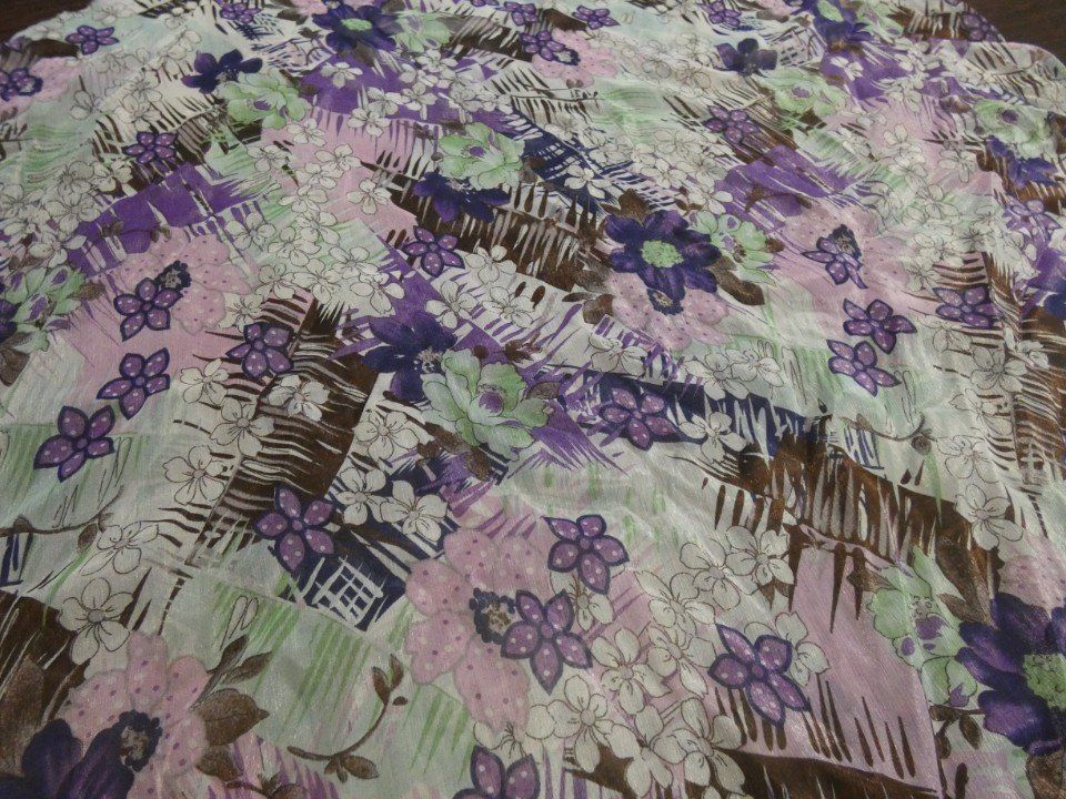 summer fabric with a pattern of lilac and light green flowers