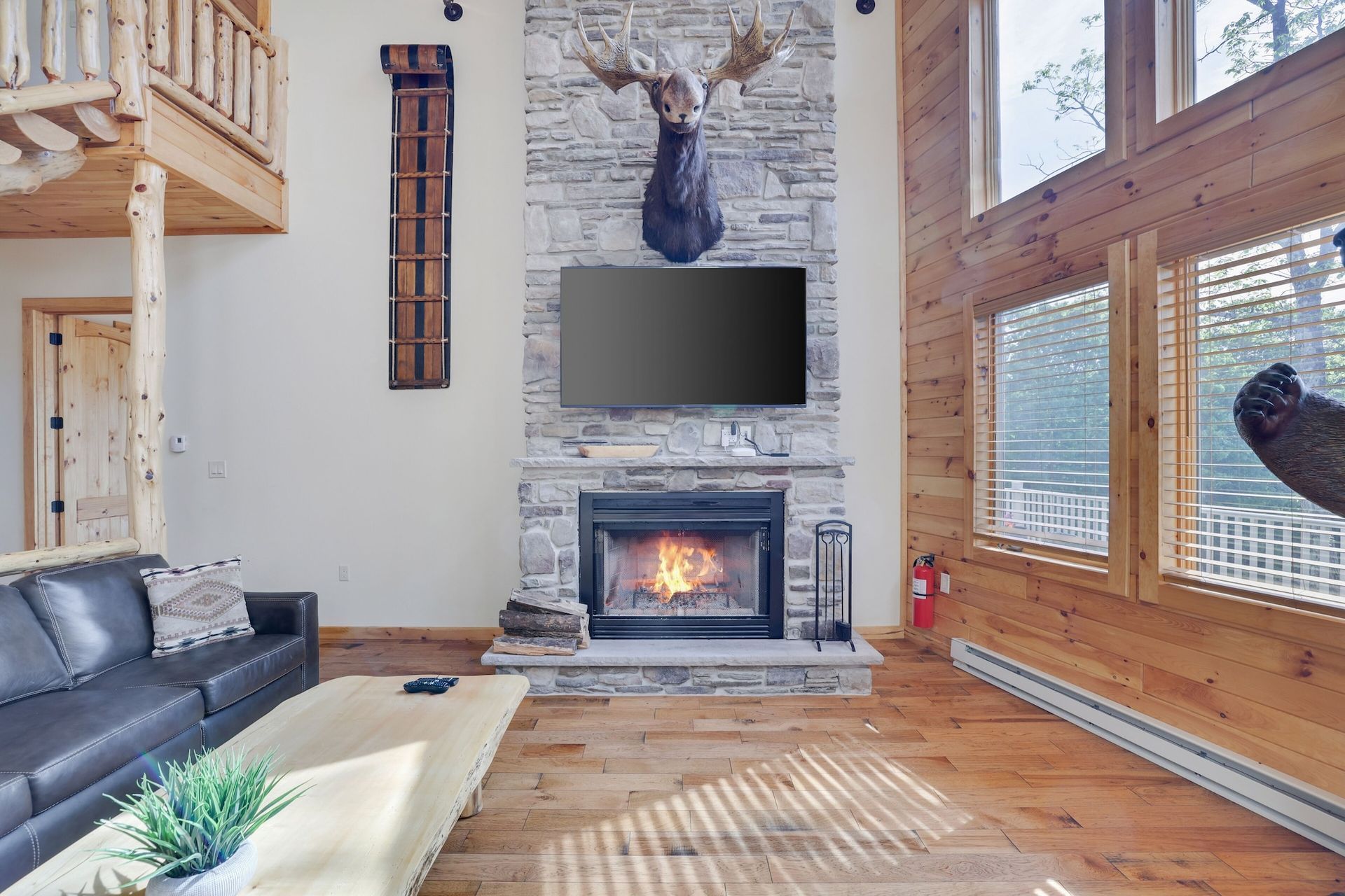 A living room with a fireplace and a flat screen tv.