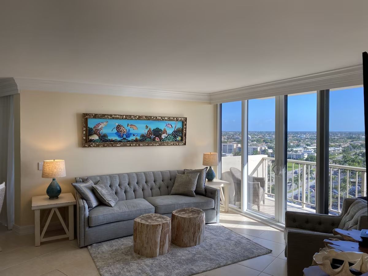 A living room with a couch and a painting on the wall