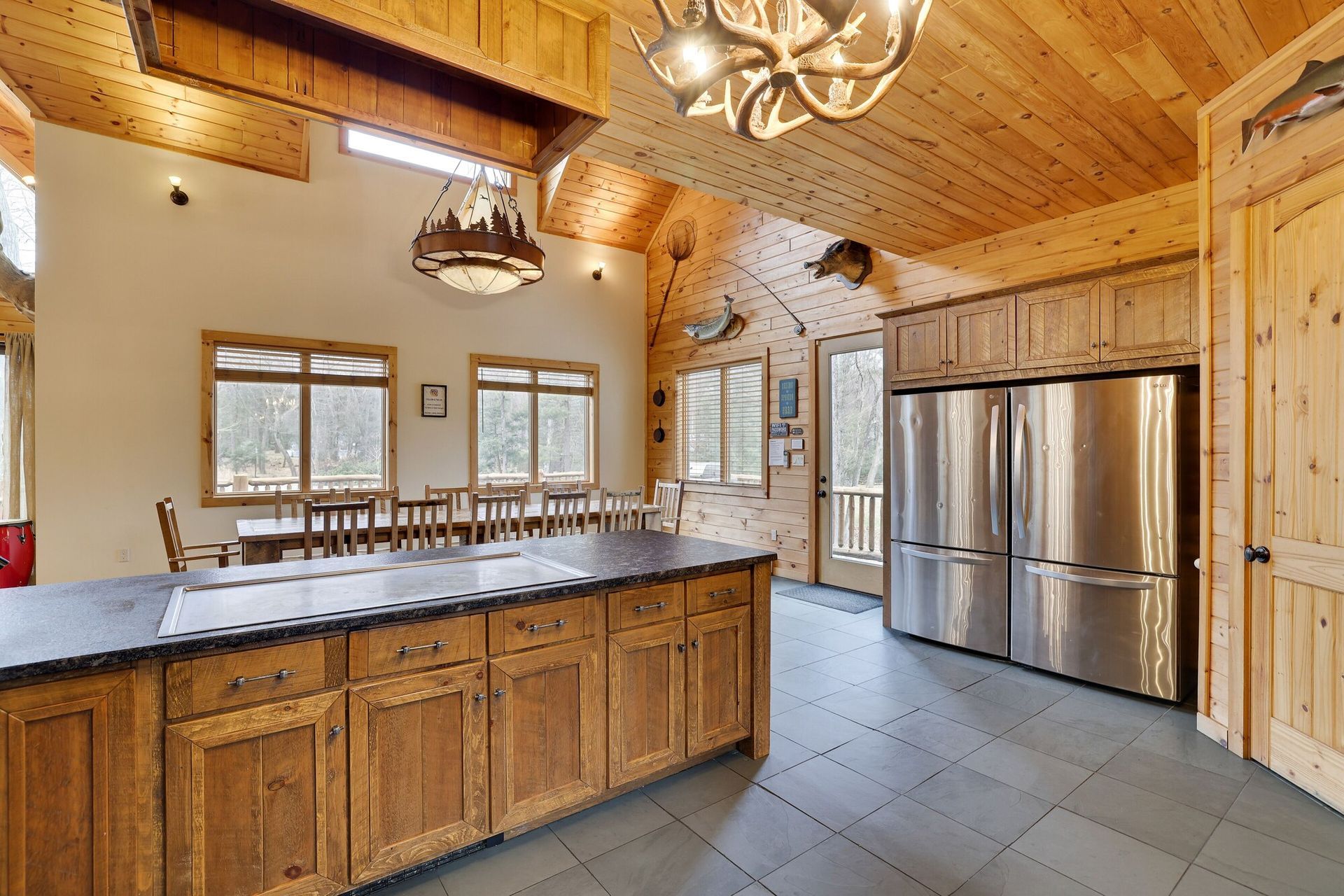 A kitchen with stainless steel appliances and wooden cabinets