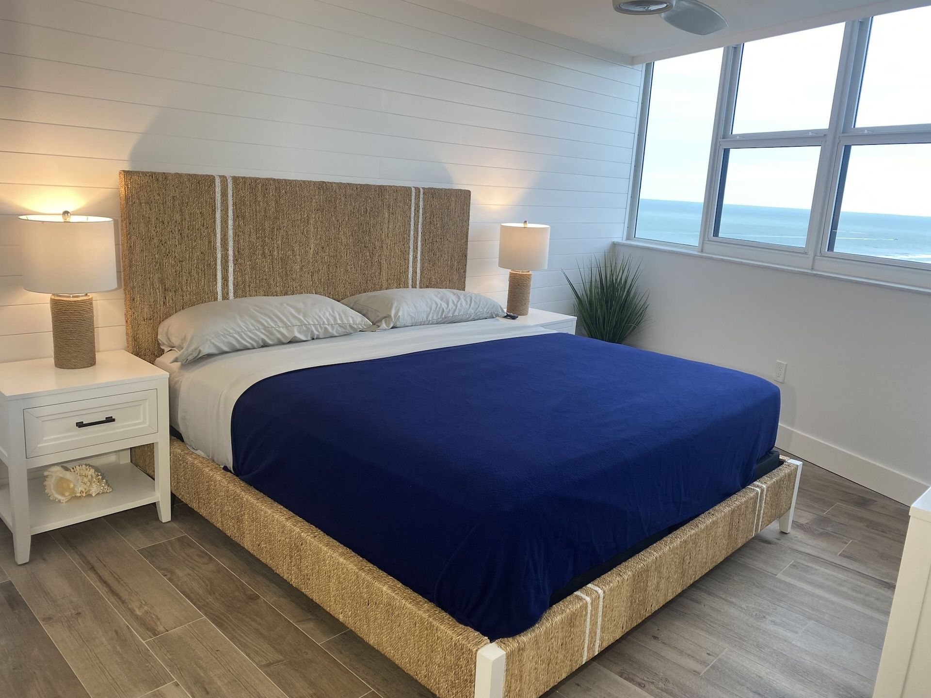 A bedroom with a king size bed and two nightstands