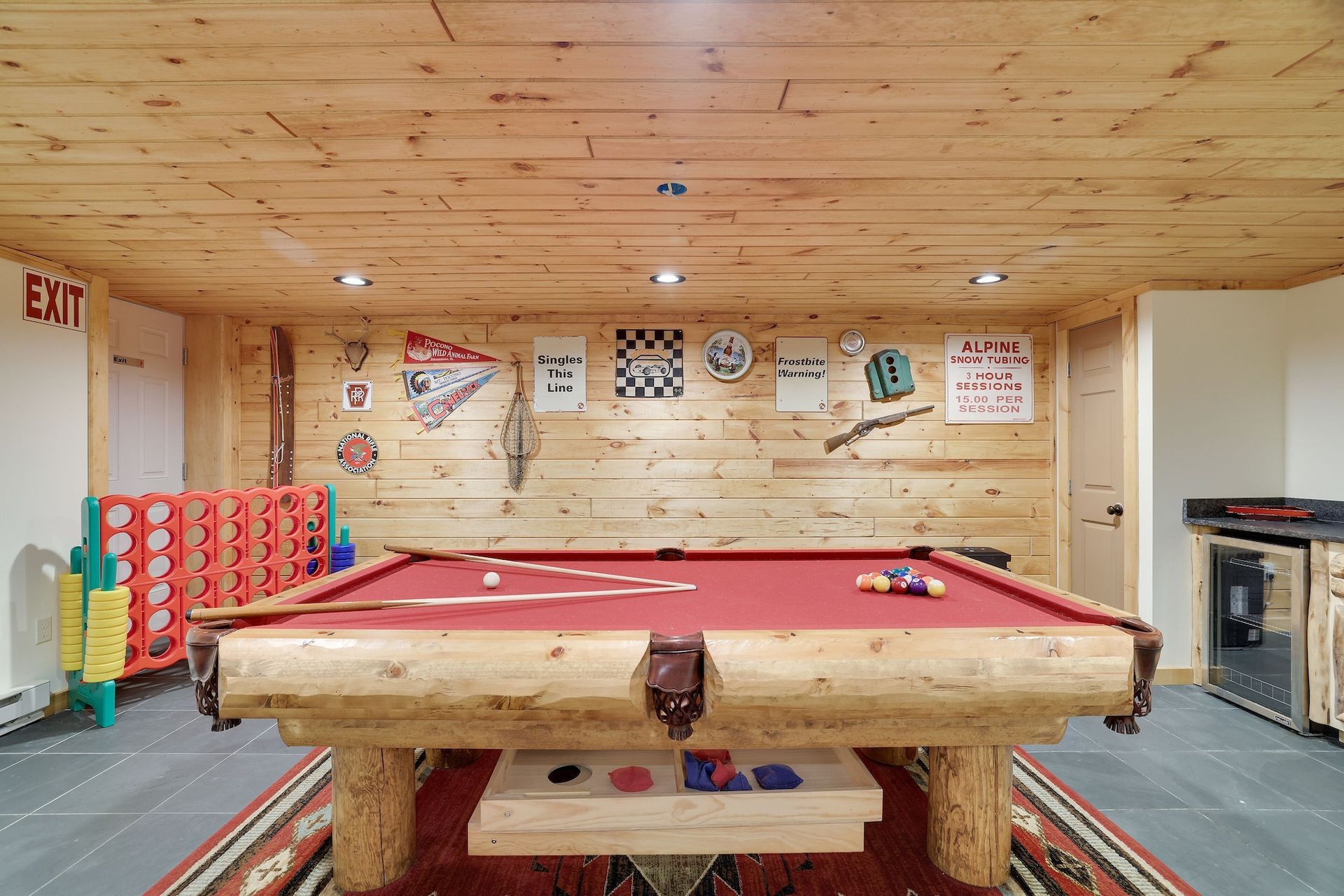 There is a pool table in the middle of the room.