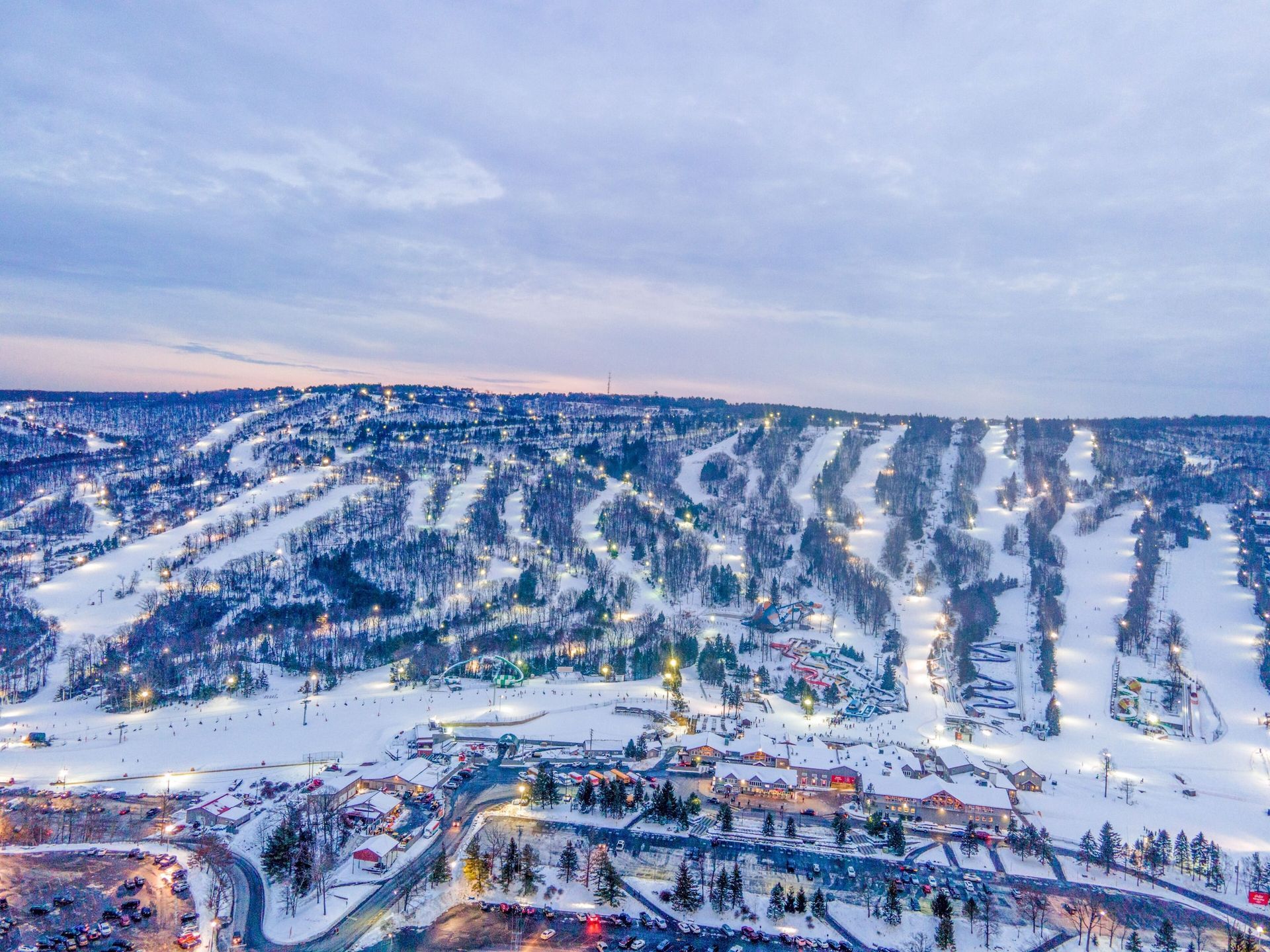 An aerial view of a ski resort at night.