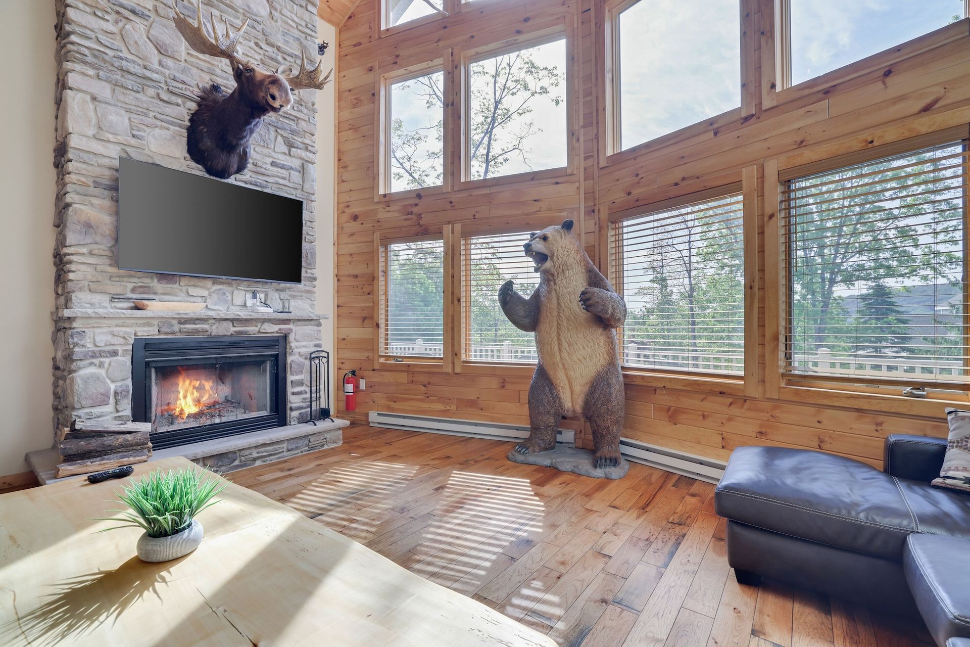 There is a statue of a bear in the living room.