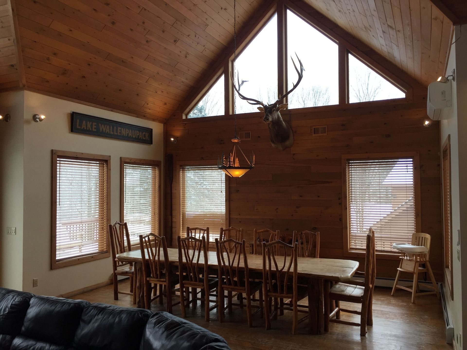 A dining room with a table and chairs and a sign that says lake washington