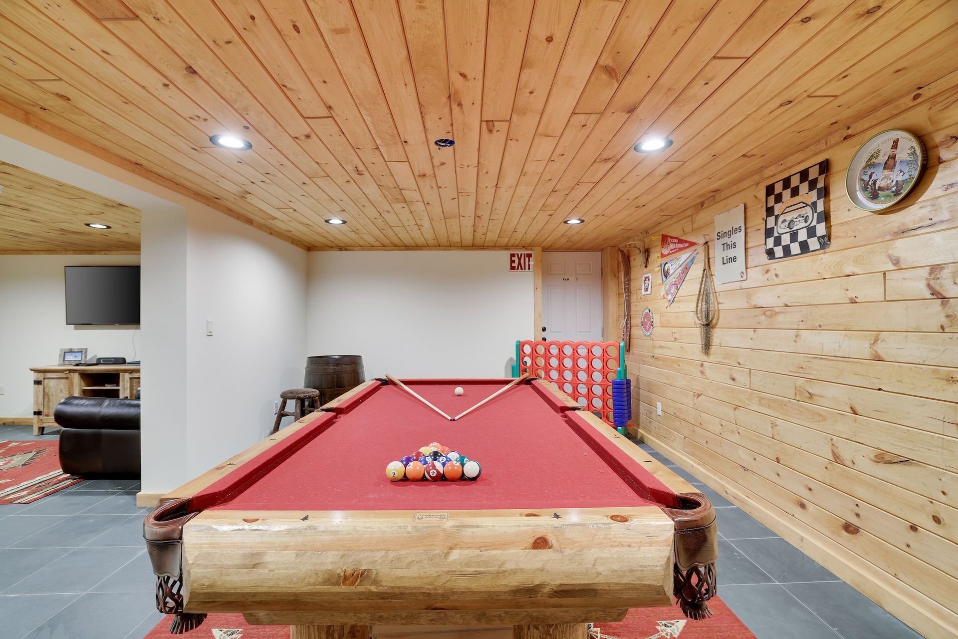 There is a pool table in the middle of the room.