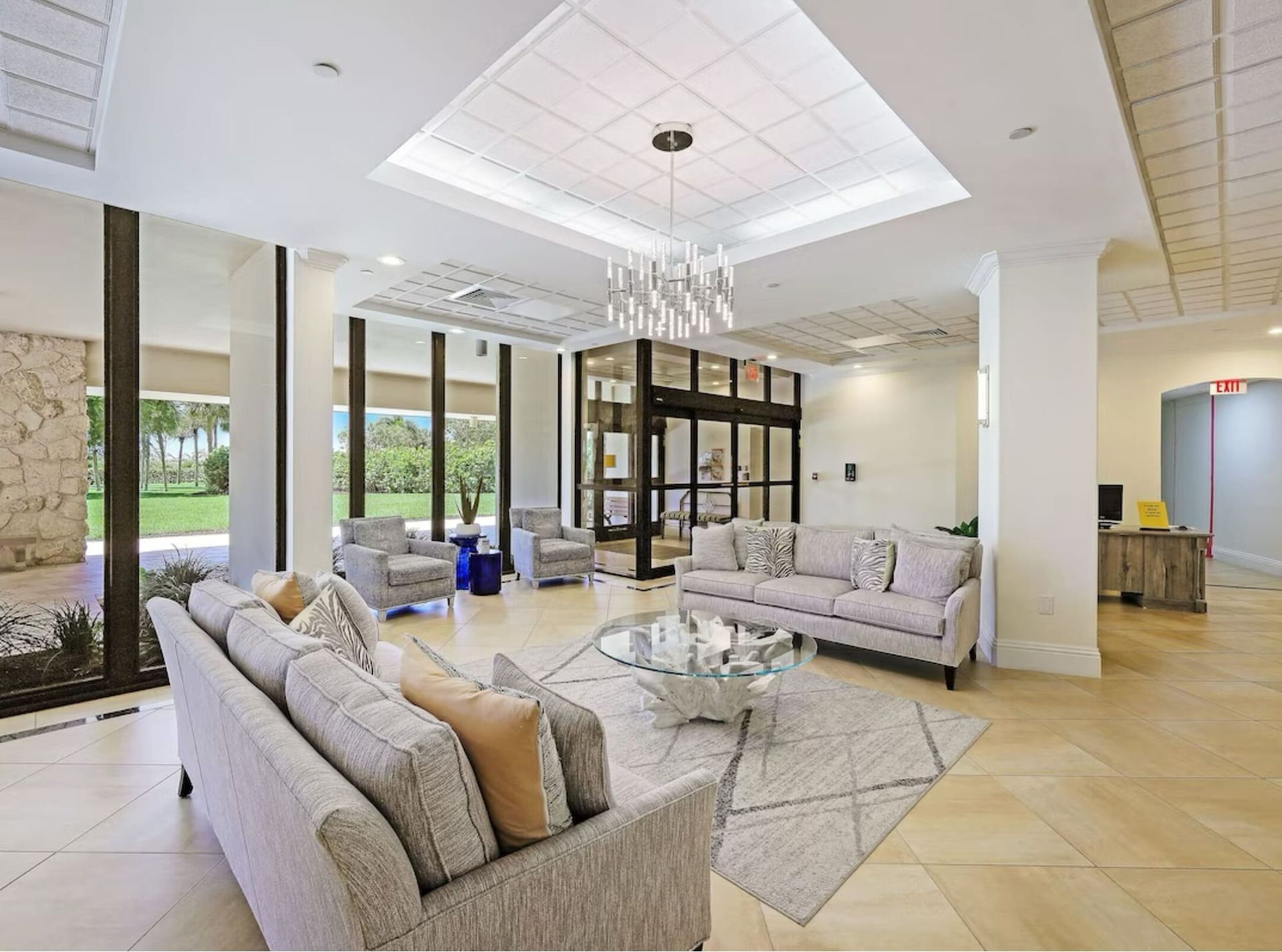 A living room filled with furniture and a chandelier.