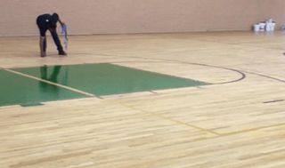 Gymnasium Floor Being Polished — Los Angeles, CA — K & Z Hardwood Flooring