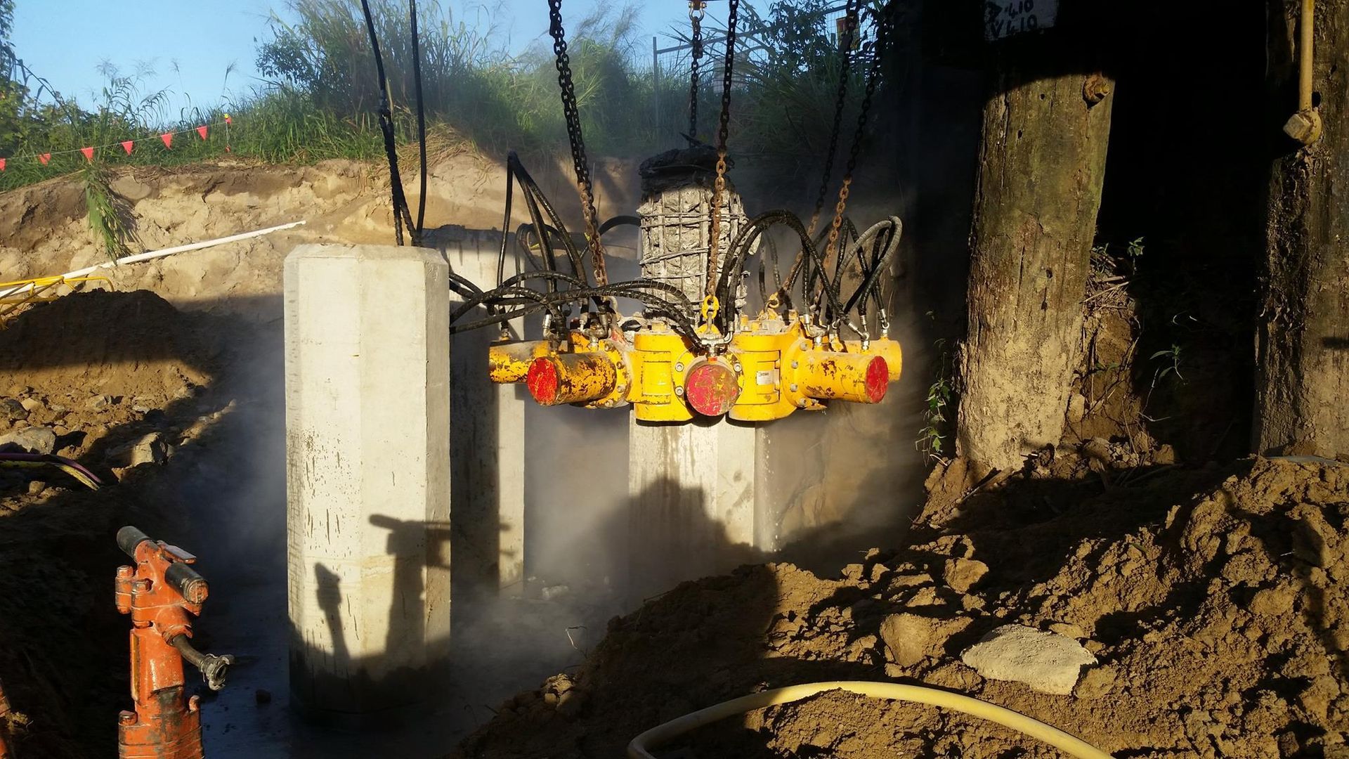 A Fence Is Surrounding a Grassy Area in Front of A Building — The Concreters in Edmonton, QLD