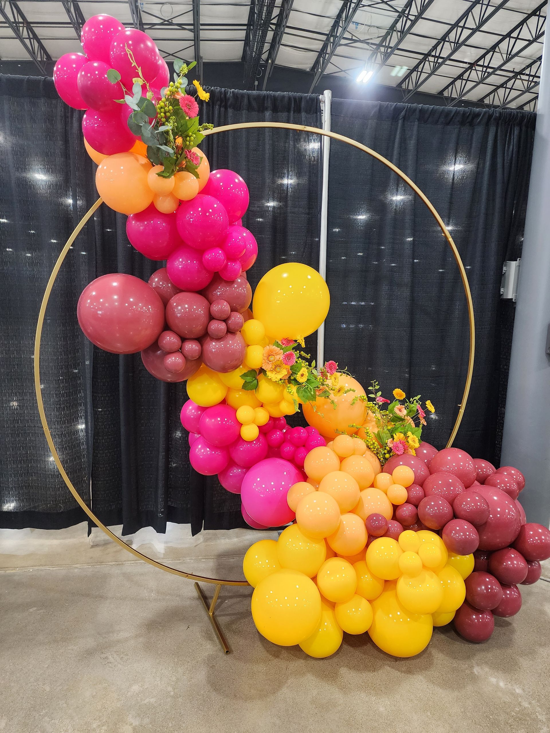 A bunch of balloons are sitting on a table in a room