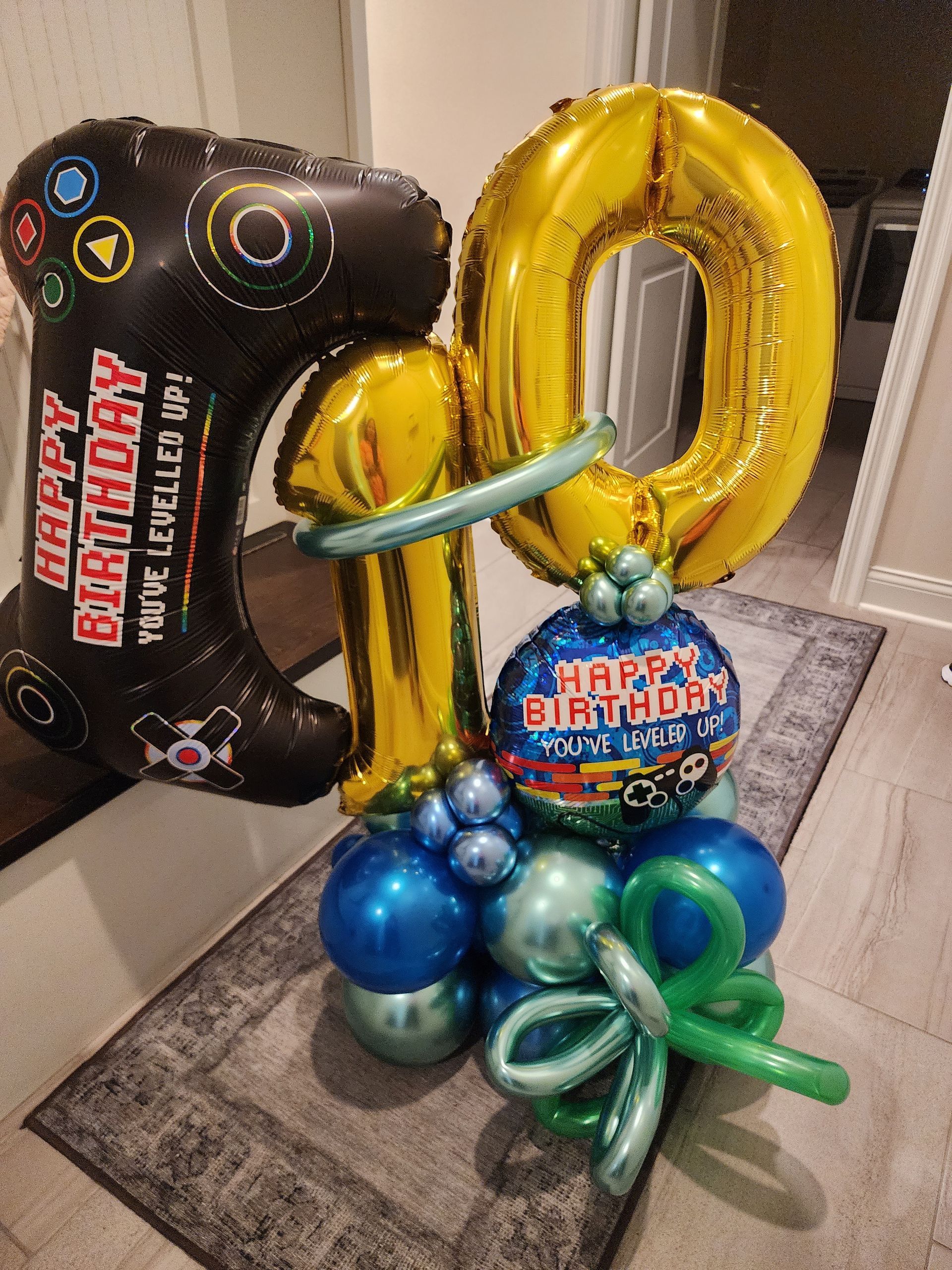 A bunch of balloons with the number 10 on them
