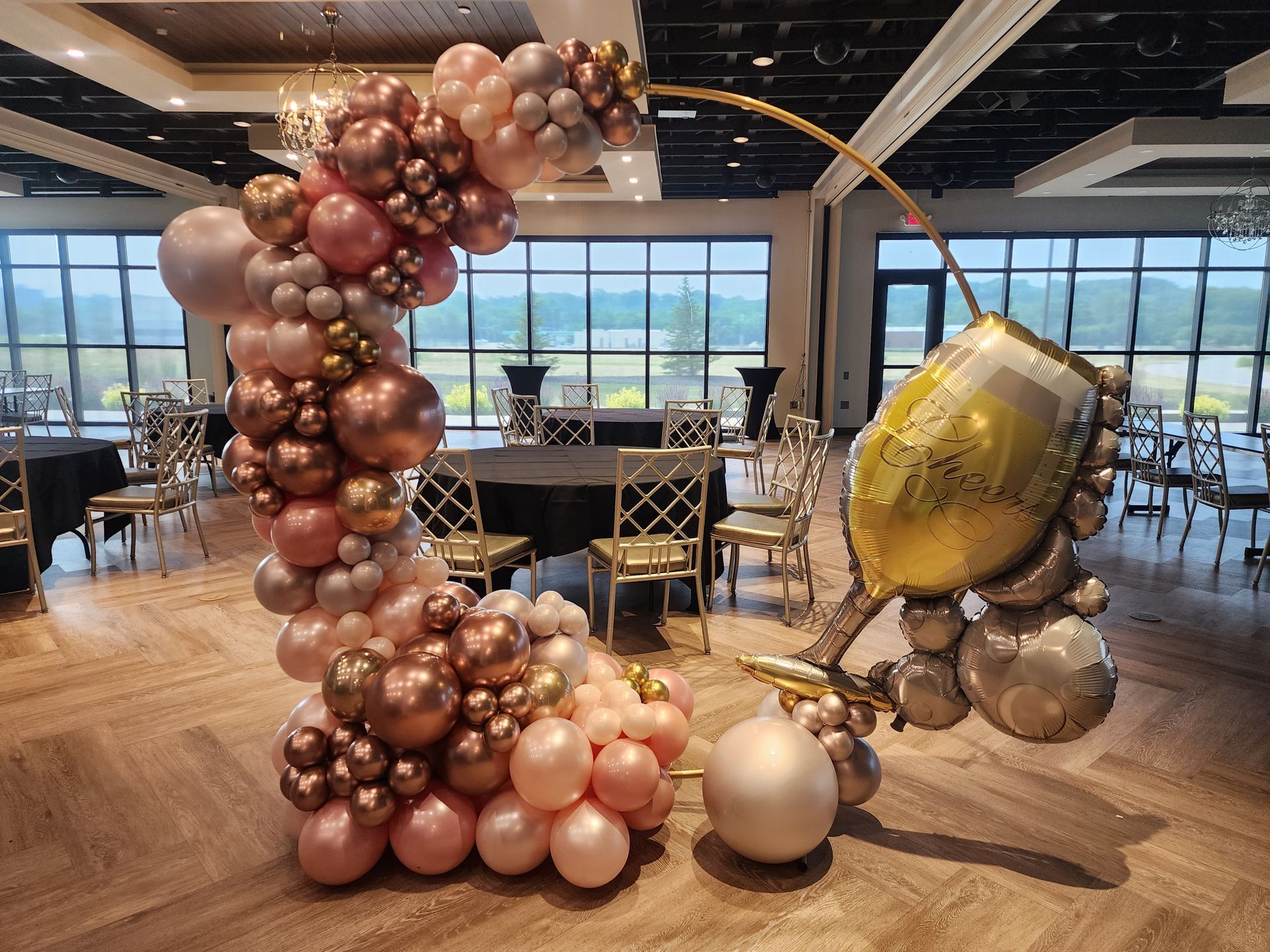 A room filled with balloons and a globe.