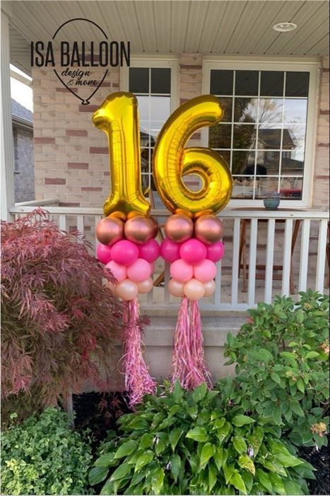 A bunch of balloons with the number 16 on them