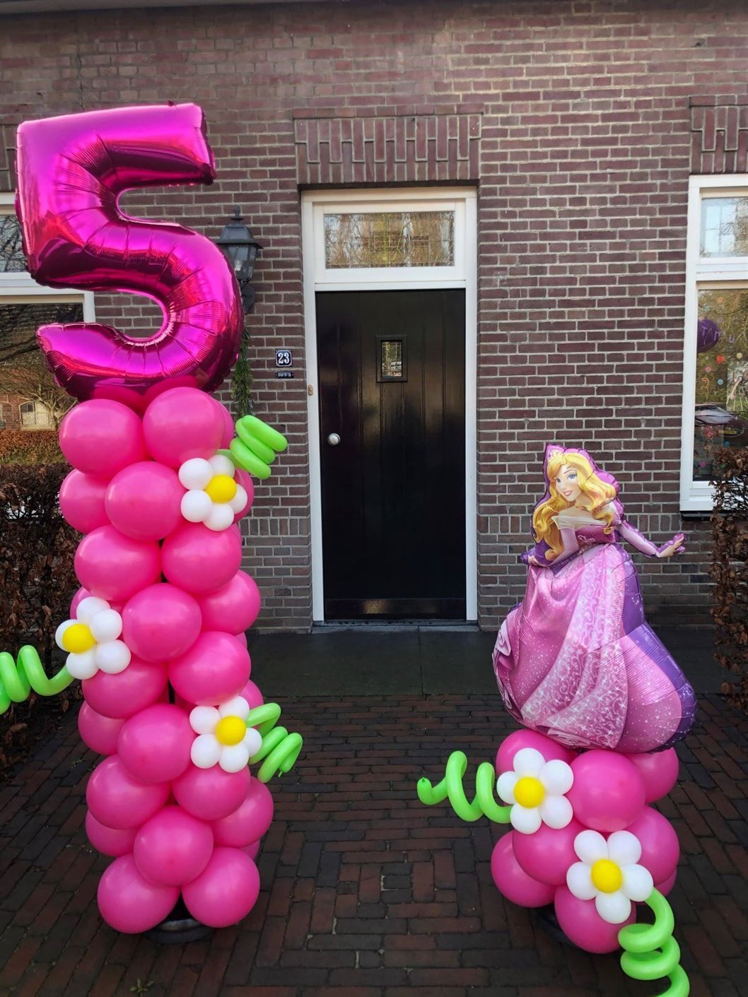 A pink balloon with the number 5 on it