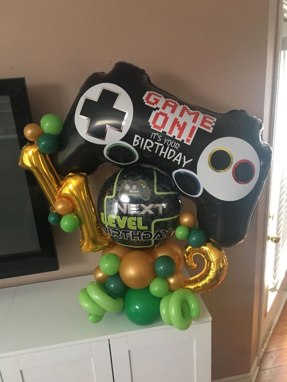 A bunch of balloons are sitting on top of a table.