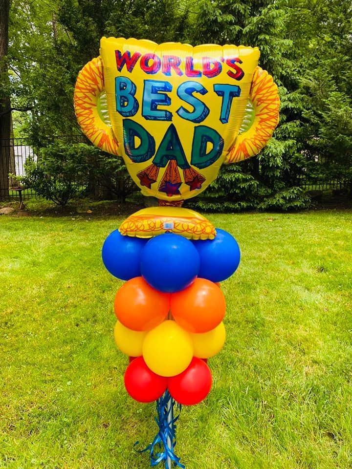 A trophy shaped balloon that says world's best dad