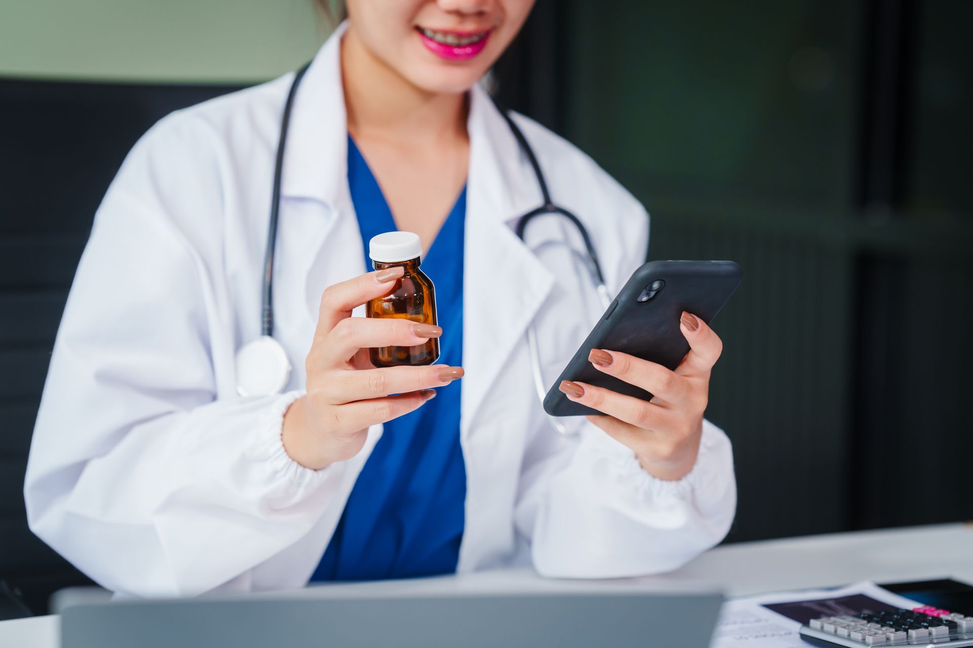 Doctor providing online consultations and psychotherapy from her desk. Doctor providing online consultations and psychotherapy from her desk.