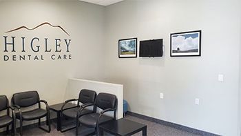 a dental office with a dental chair and a monitor .
