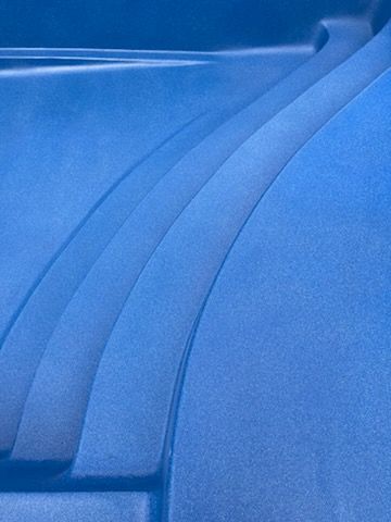 Blue swimming pool steps.