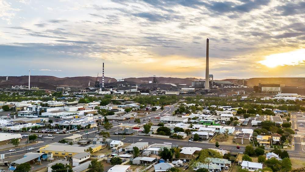 An Aerial View of a City With a Sunset in the Background — Downright Carpentry in Ryan, QLD