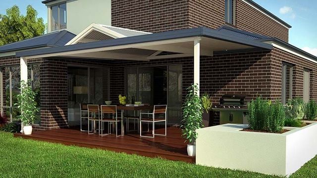 An Artist's Impression of a Brick House With a Porch and a Table and Chairs — Downright Carpentry in Ryan, QLD
