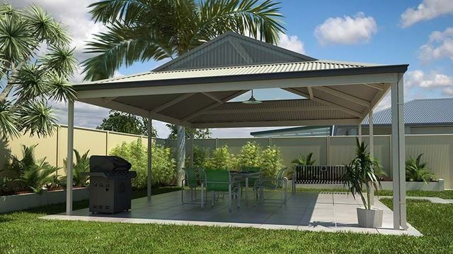 Gazebo in a Backyard With a Grill and Tables and Chairs Underneath It — Downright Carpentry in Ryan, QLD