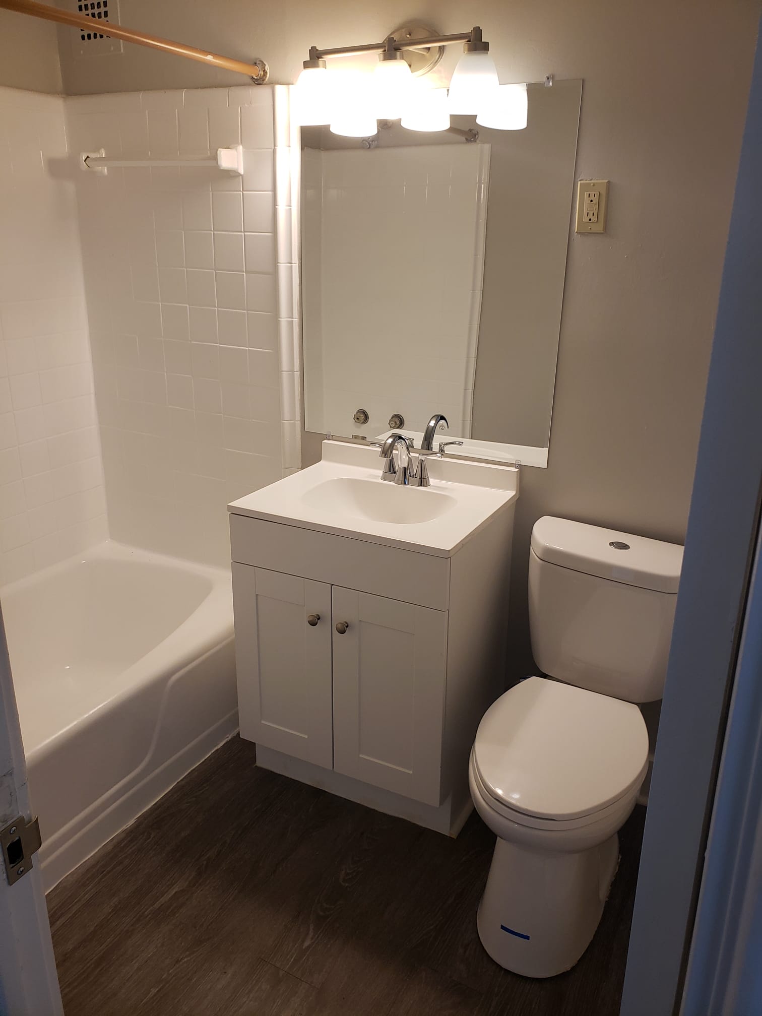 Bathroom with tub, sink, and toilet