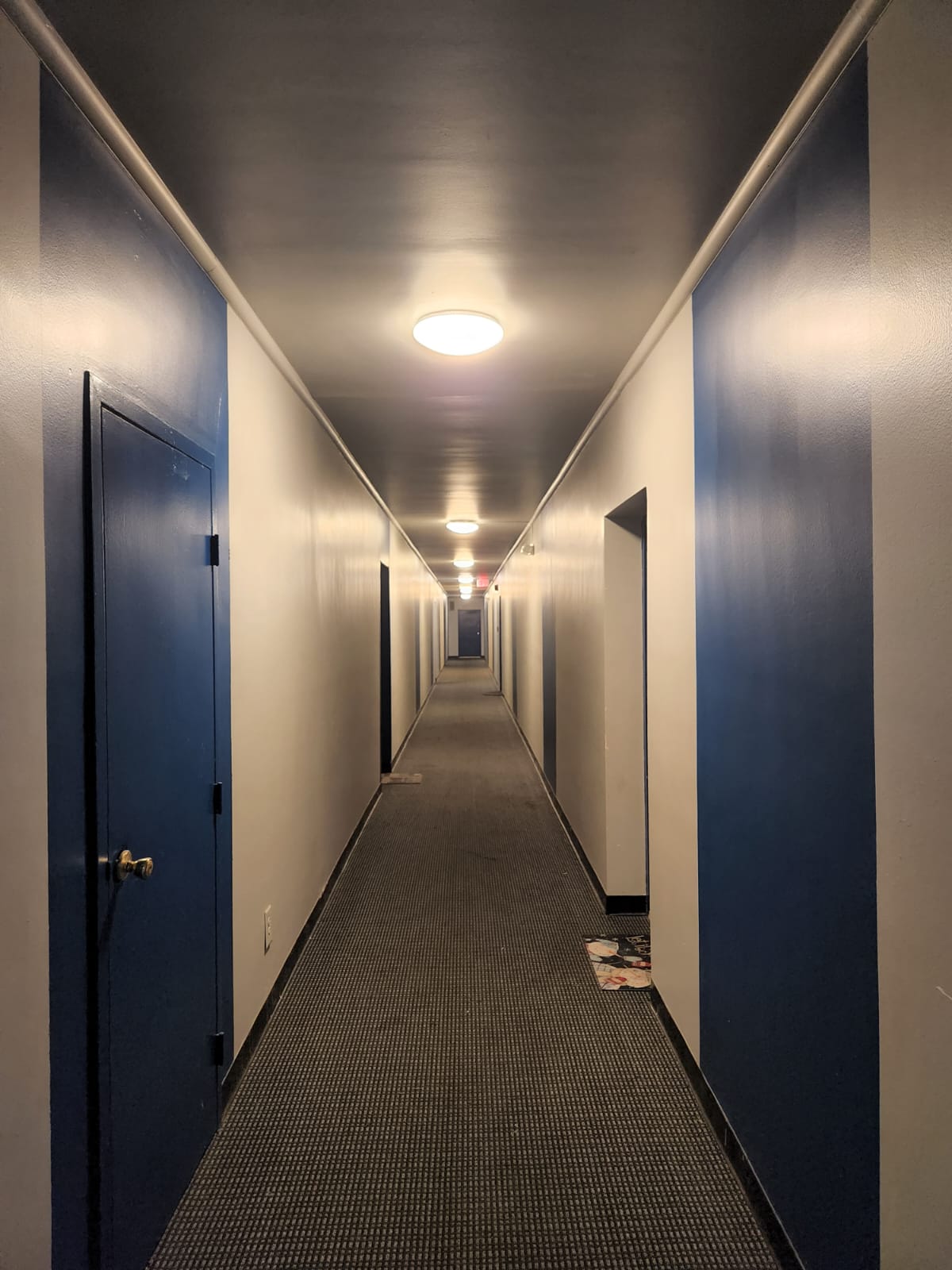 The Swift and Current Apartments hallways and view of front doors of units.