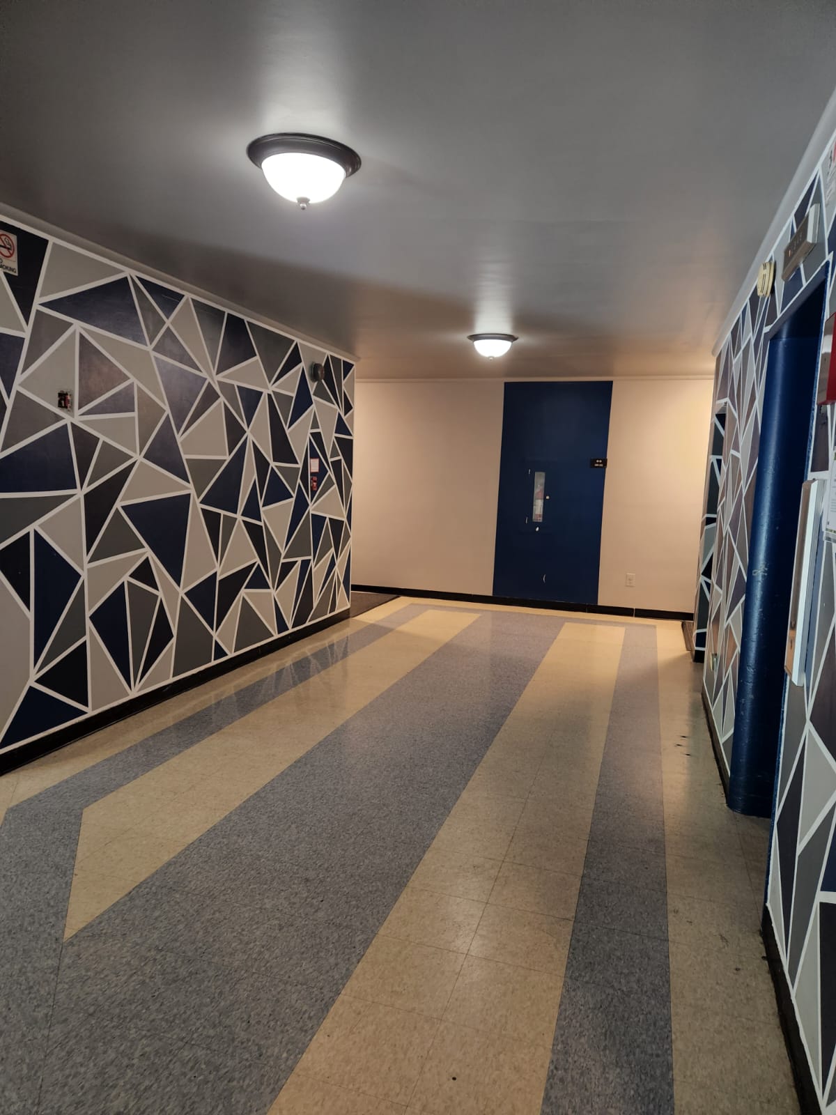 The Swift and Current Apartments hallways and view of front doors of units.