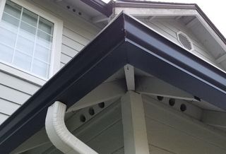 Roof and Gutter Repair | House with Gutter Draining System | Bothell, WA