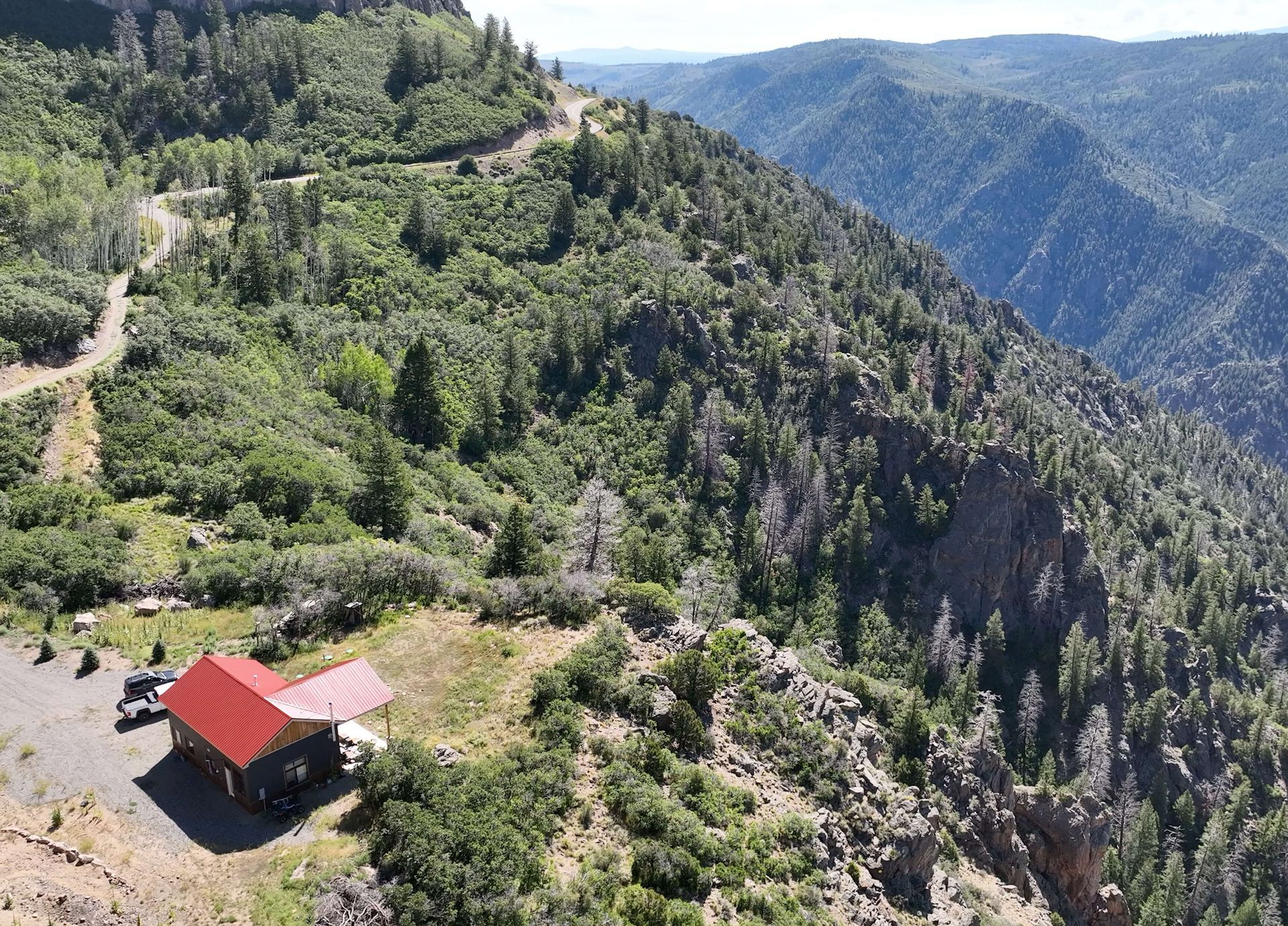 An aerial view of a house on top of a mountain Maven Construction, Montrose, CO