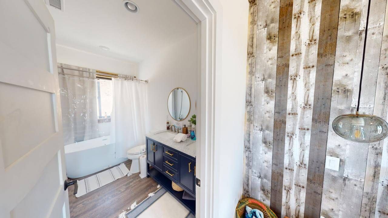 A bathroom with a sink , toilet , and bathtub. Maven Construction, Montrose, CO