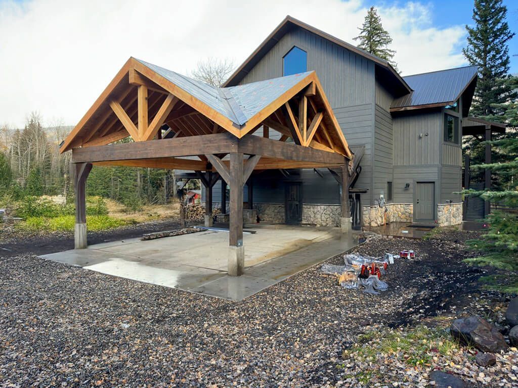 A large house with a carport in front of it. Maven Construction, Montrose, CO